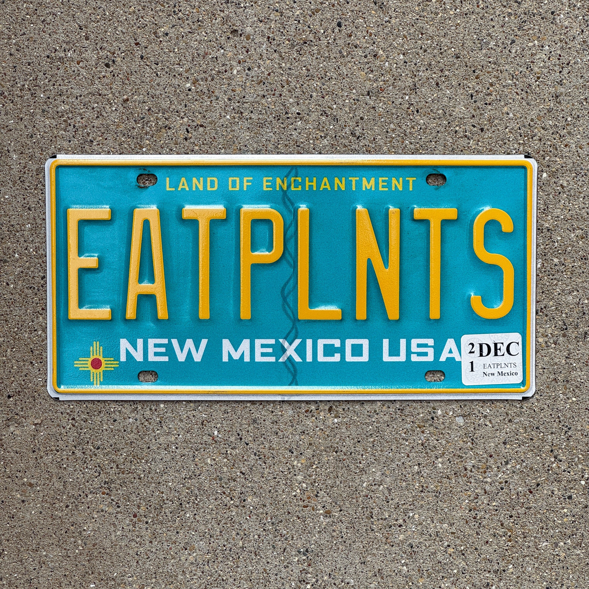 Photo of a 2010 2021 New Mexico Vanity License Plate Auto Tag Garage Decor Vintage Eat Plants Vegetarian Vegan EATPLNTS with original patina