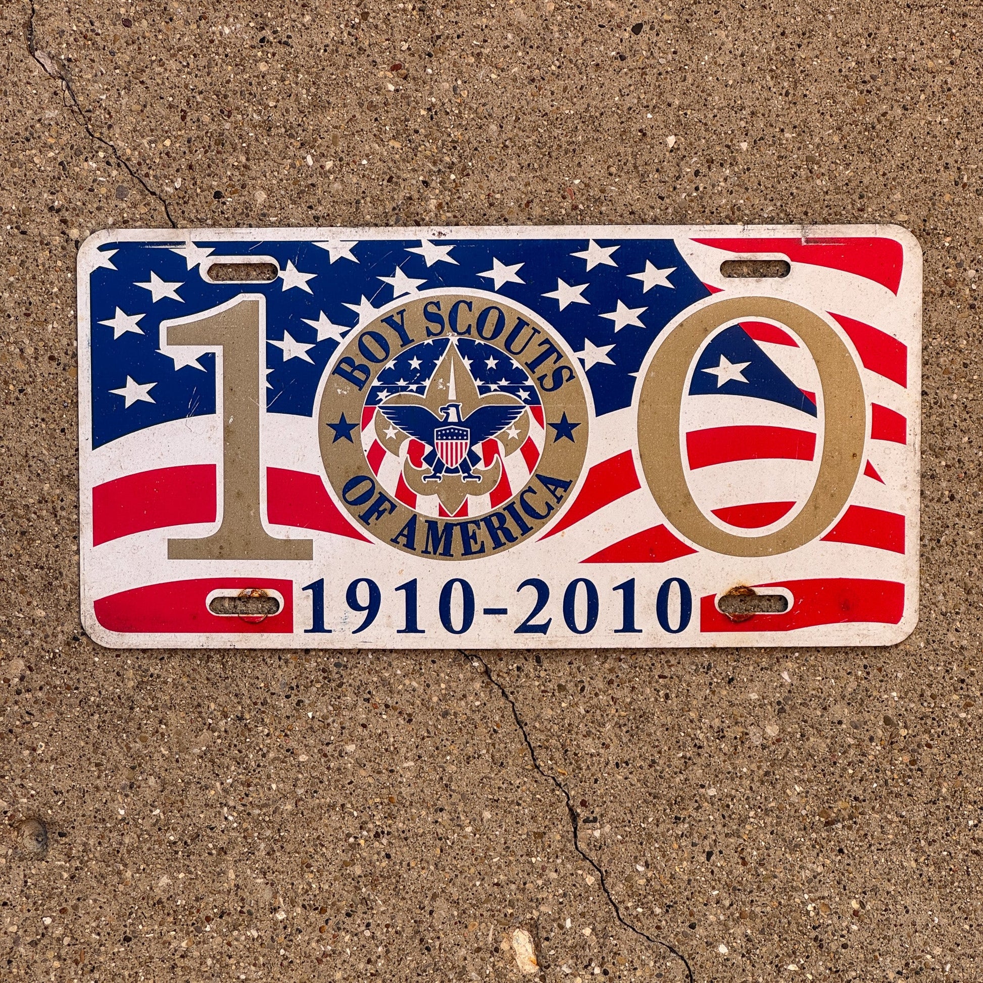 Photo of a 2010 Booster License Plate Auto Tag Garage Decor Vintage Metal Boy Scouts 100 Year Anniversary