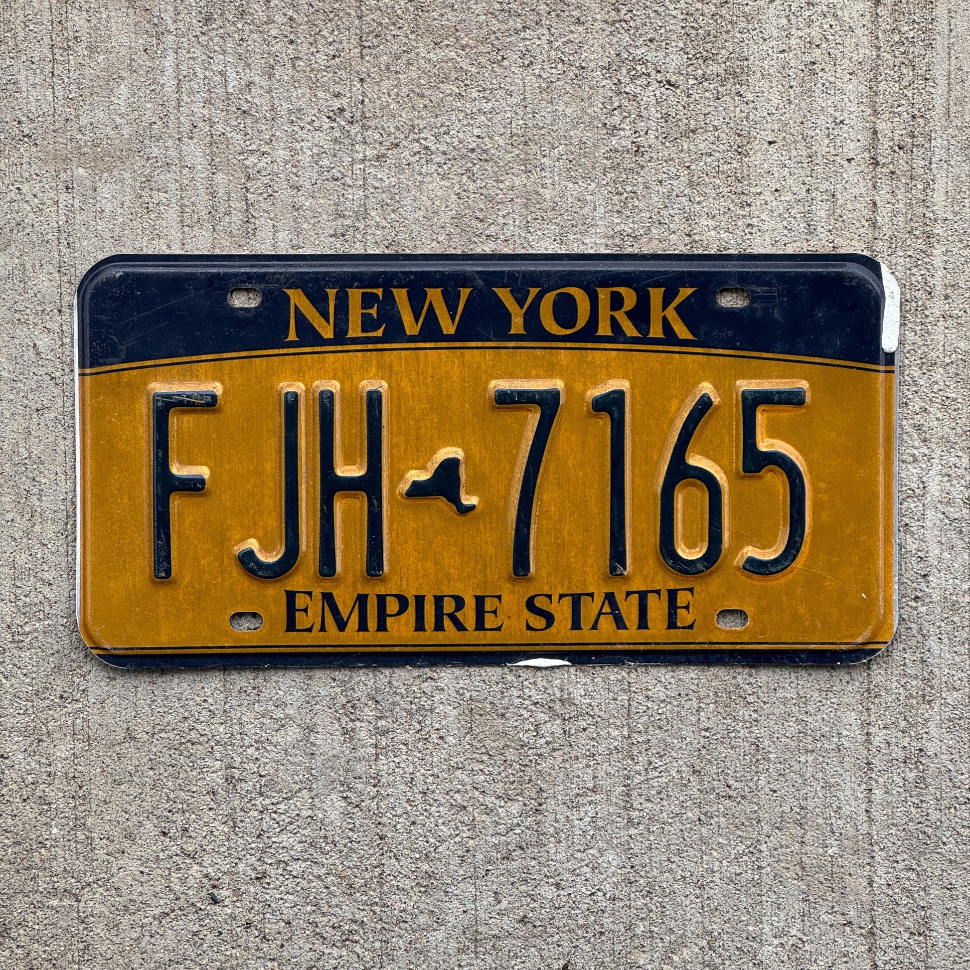 Photo of a 2010 New York License Plate Auto Tag Garage Decor Vintage FJH 7165