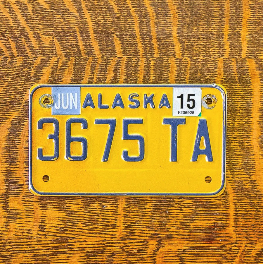 Photo of a 2011 2015 Alaska Motorcycle License Plate Auto Tag Garage Decor Vintage 3675 TA with original patina