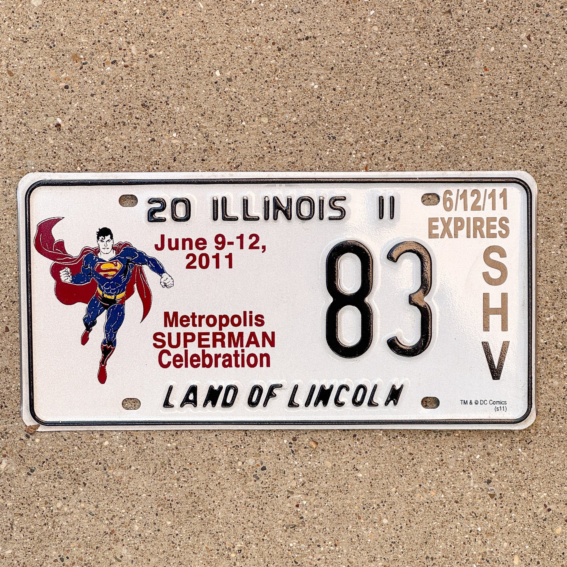 Photo of a 2011 Illinois Event License Plate Auto Tag 2 Garage Decor Metropolis Illinois Superman Comics 83 with original patina