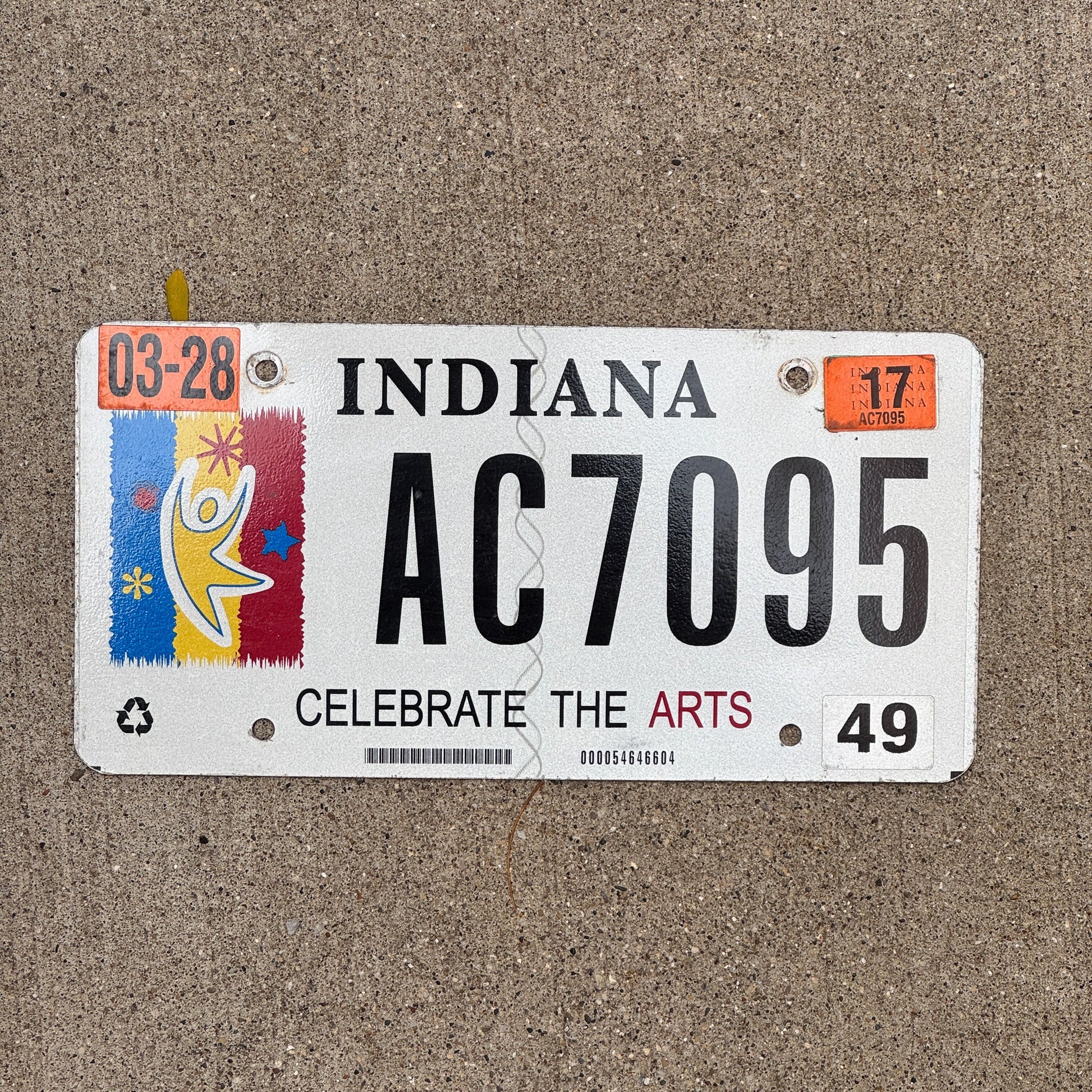 Photo of a 2012 2017 Indiana Graphic / Specialty License Plate Auto Tag Garage Decor Vintage Celebrate Arts Trust AC 7095 with original patina