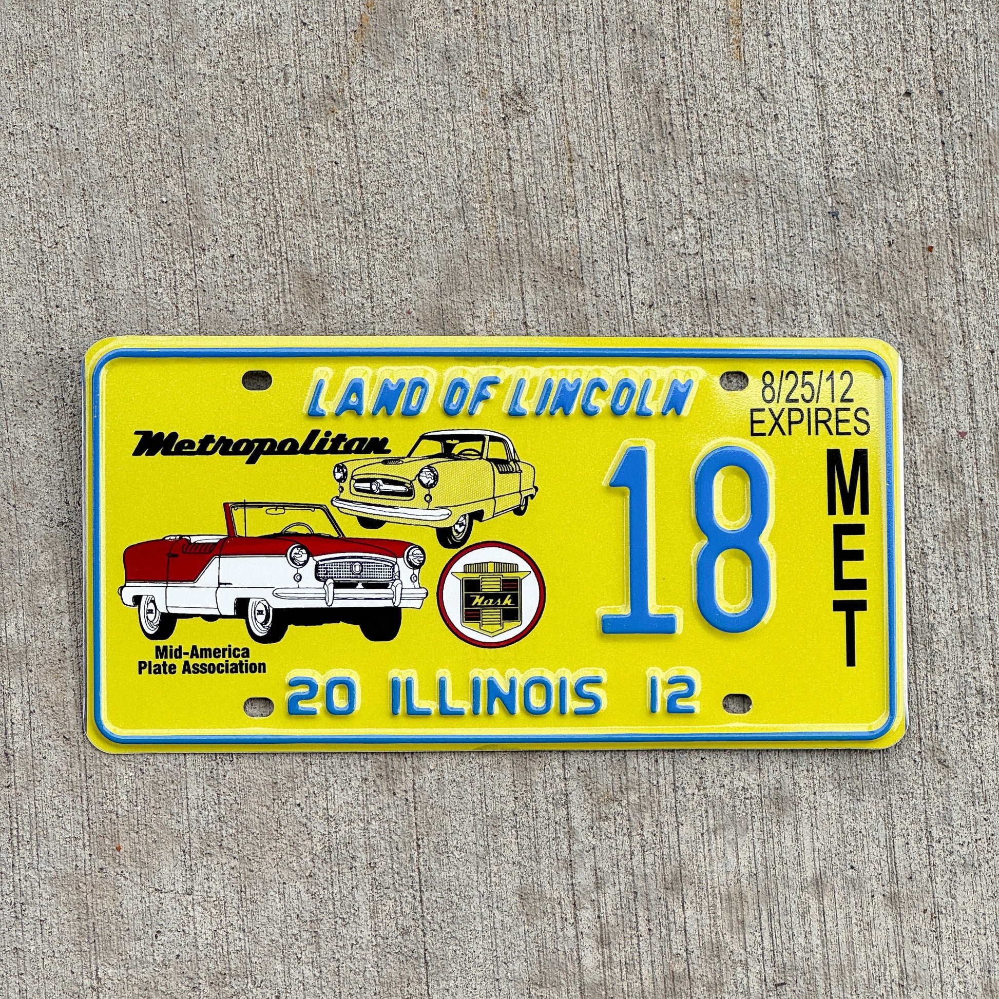 Photo of a 2012 Illinois Event License Plate Auto Tag Garage Decor Vintage Nash Metropolitan MAPA 18 with original patina