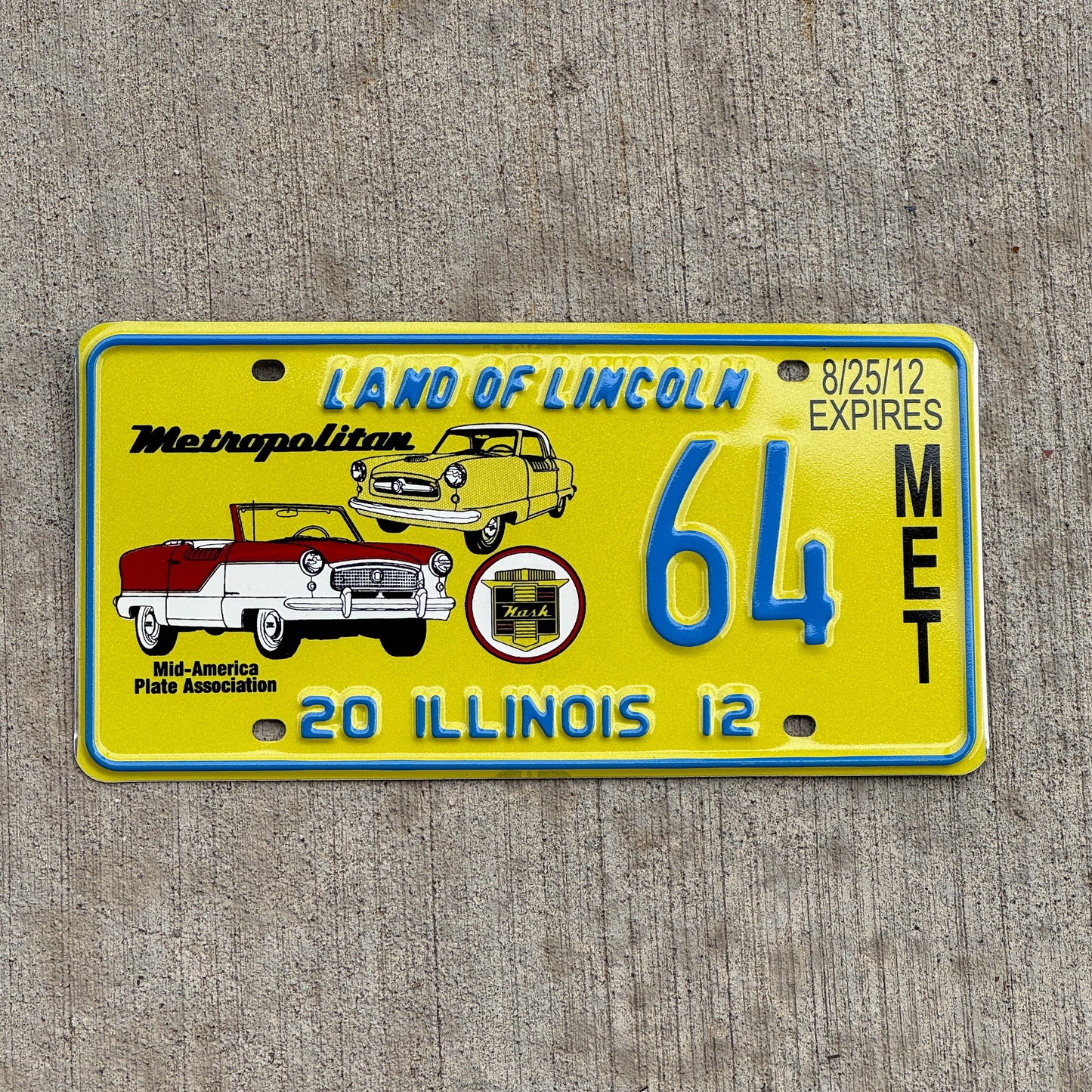 Photo of a 2012 Illinois Event License Plate Auto Tag Garage Decor Vintage Nash Metropolitan MAPA 64 with original patina