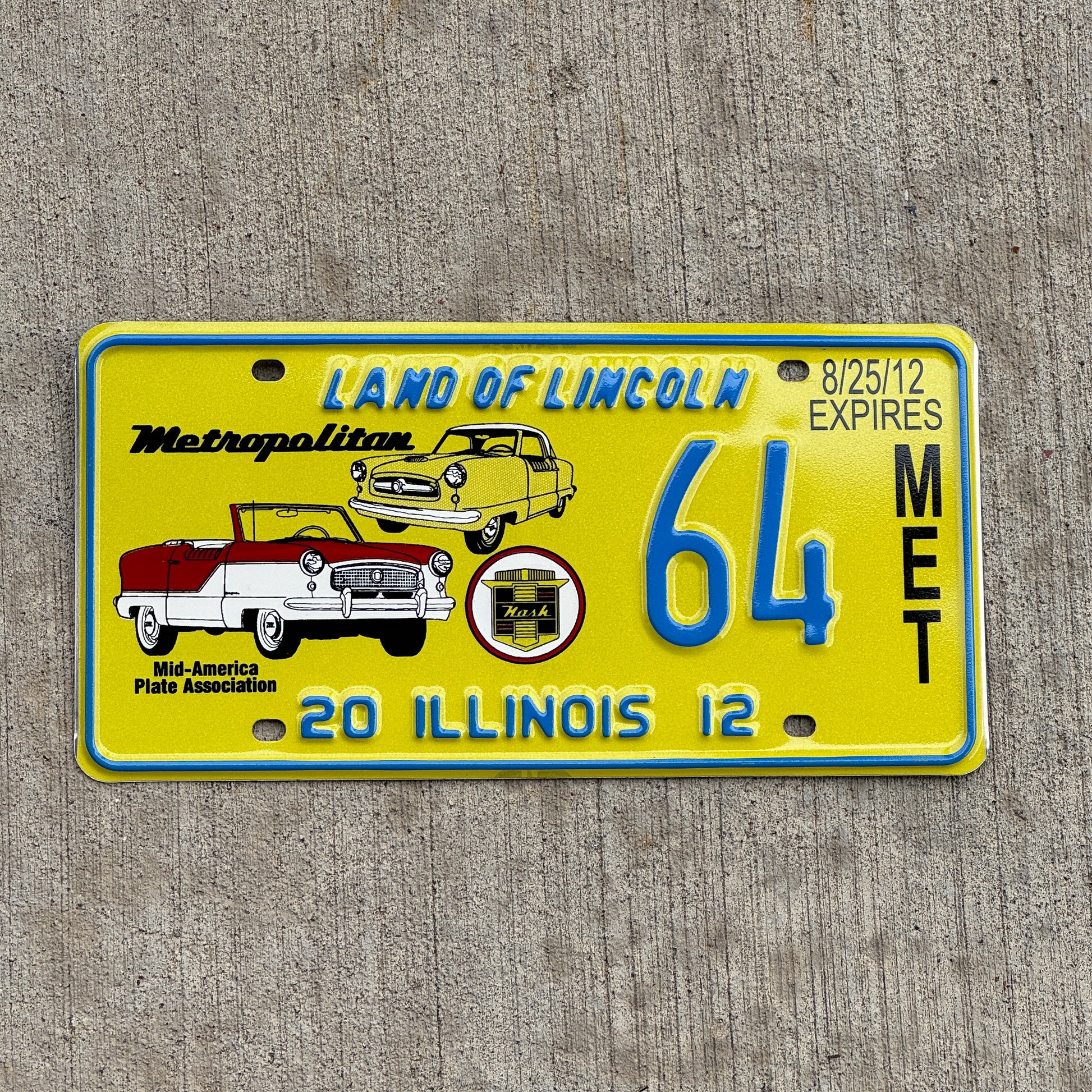 Photo of a 2012 Illinois Event License Plate Auto Tag Garage Decor Vintage Nash Metropolitan MAPA 64 with original patina