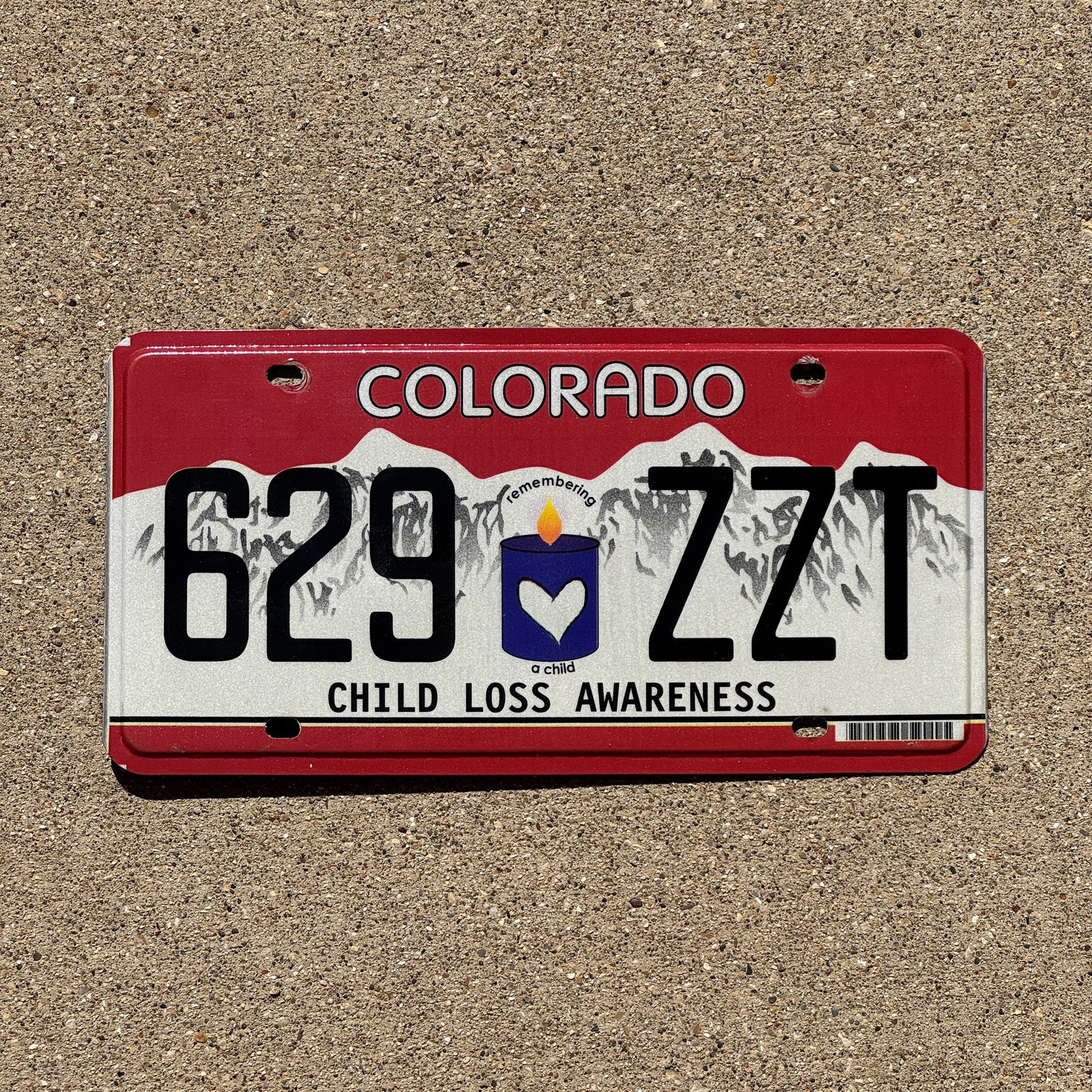 Photo of a 2013 Colorado Graphic / Specialty License Plate Auto Tag 2 Garage Decor Child Loss Awareness 629 ZZT