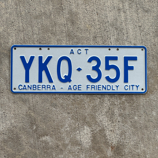 Photo of a 2015 Australian Capital Territory ACT License Plate Auto Tag Garage Decor Vintage Canberra Age Friendly City YKQ 35F with original patina