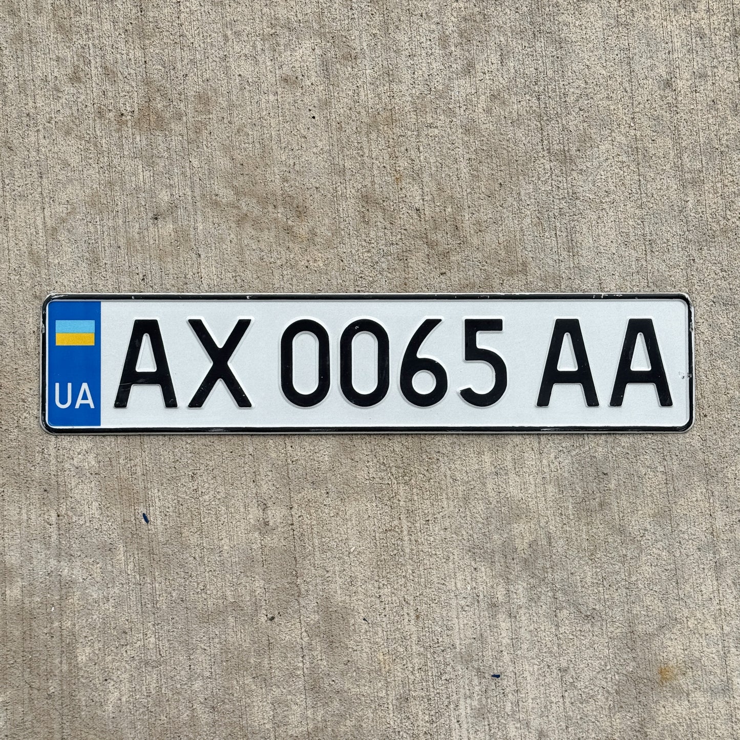 Photo of a 2015 Ukraine License Plate Auto Tag Garage Decor Vintage AX 0065 AA with original patina