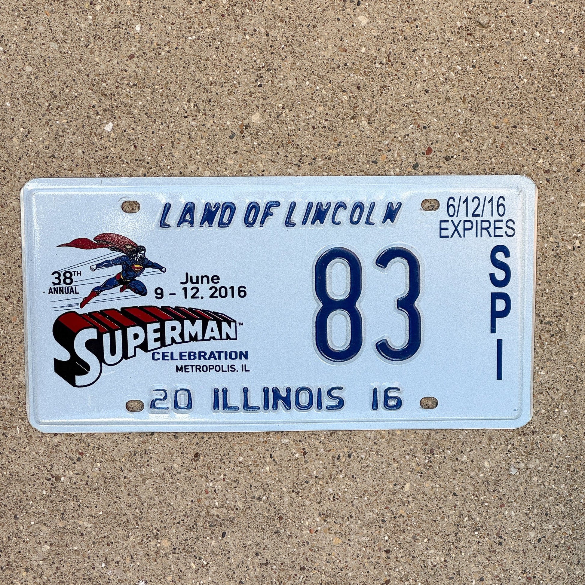 Photo of a 2016 Illinois Event License Plate Auto Tag 1 Garage Decor Metropolis Illinois Superman Comics 83 with original patina