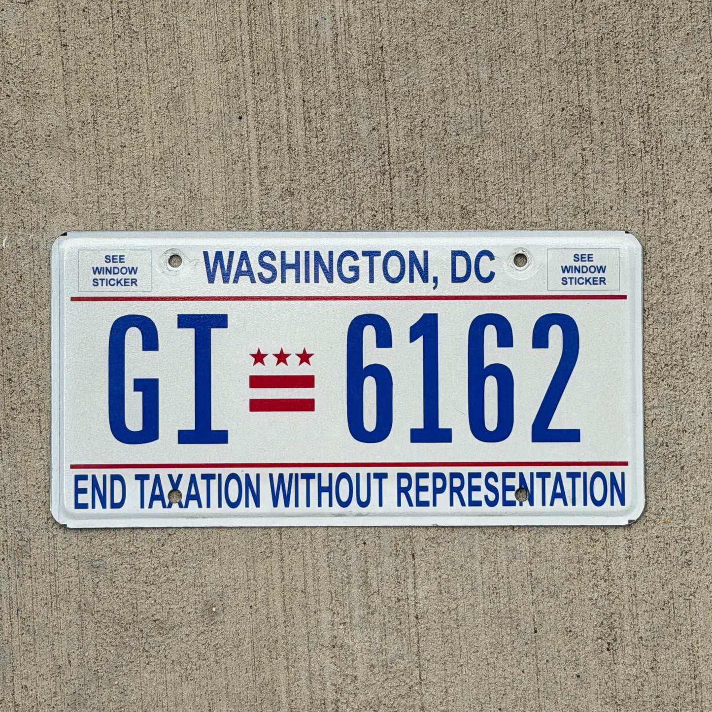 Photo of a 2017 Washington DC License Plate Auto Tag 1 Vintage Garage End Taxation Without Representation GI 6162 with original patina