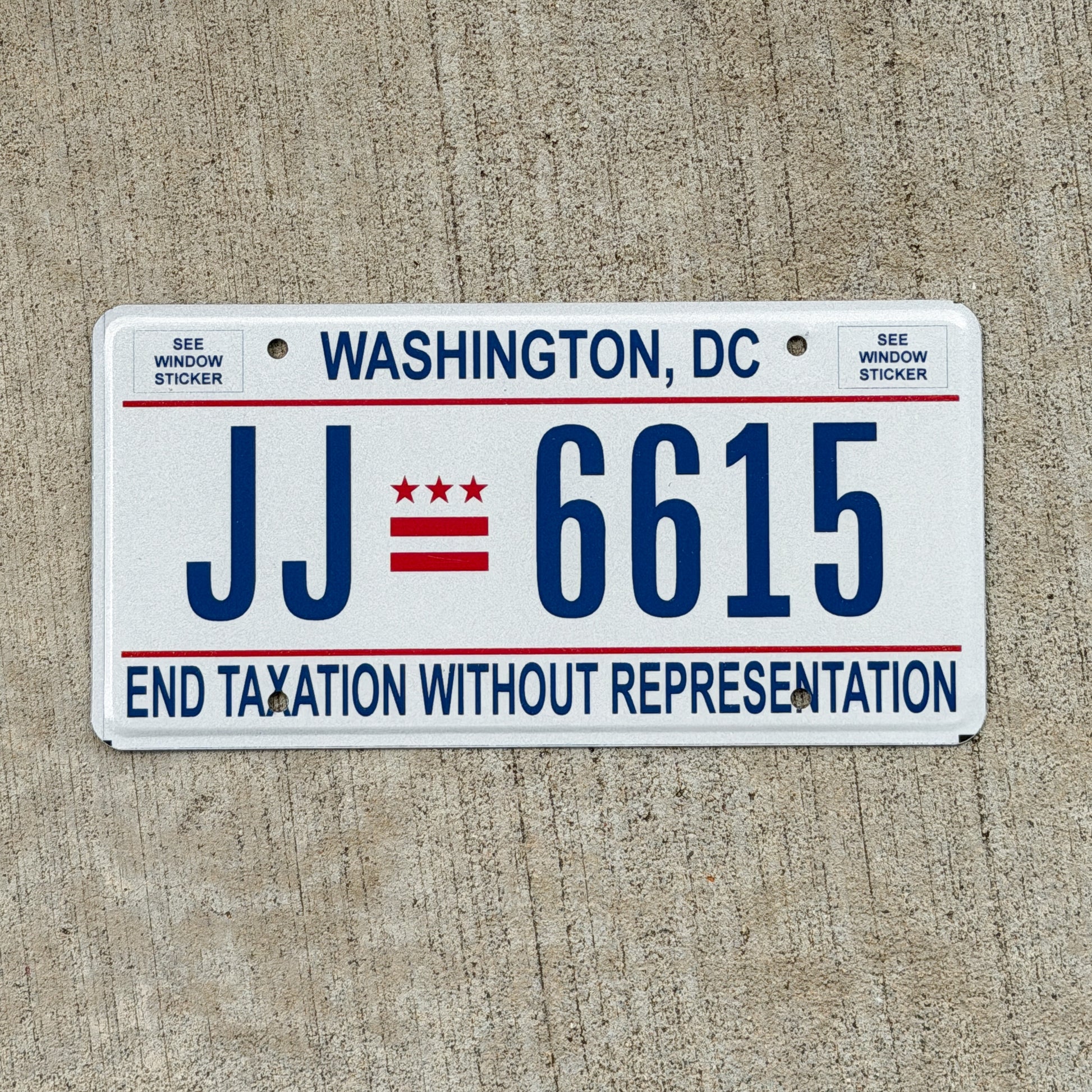 Photo of a 2017 Washington DC License Plate Auto Tag 1 Vintage Garage End Taxation Without Representation JJ 6615 with original patina