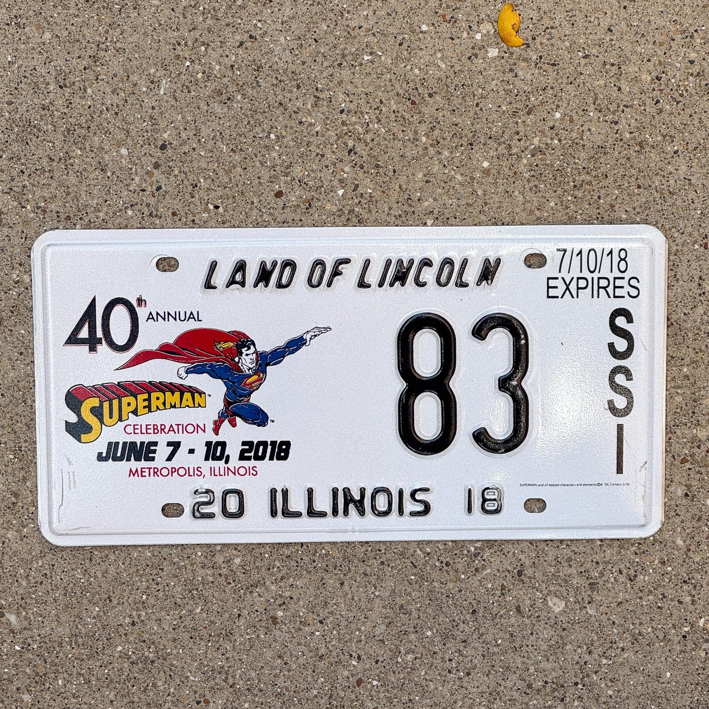Photo of a 2018 Illinois Event License Plate Auto Tag 1 Garage Decor Metropolis Illinois Superman Comics 83 with original patina