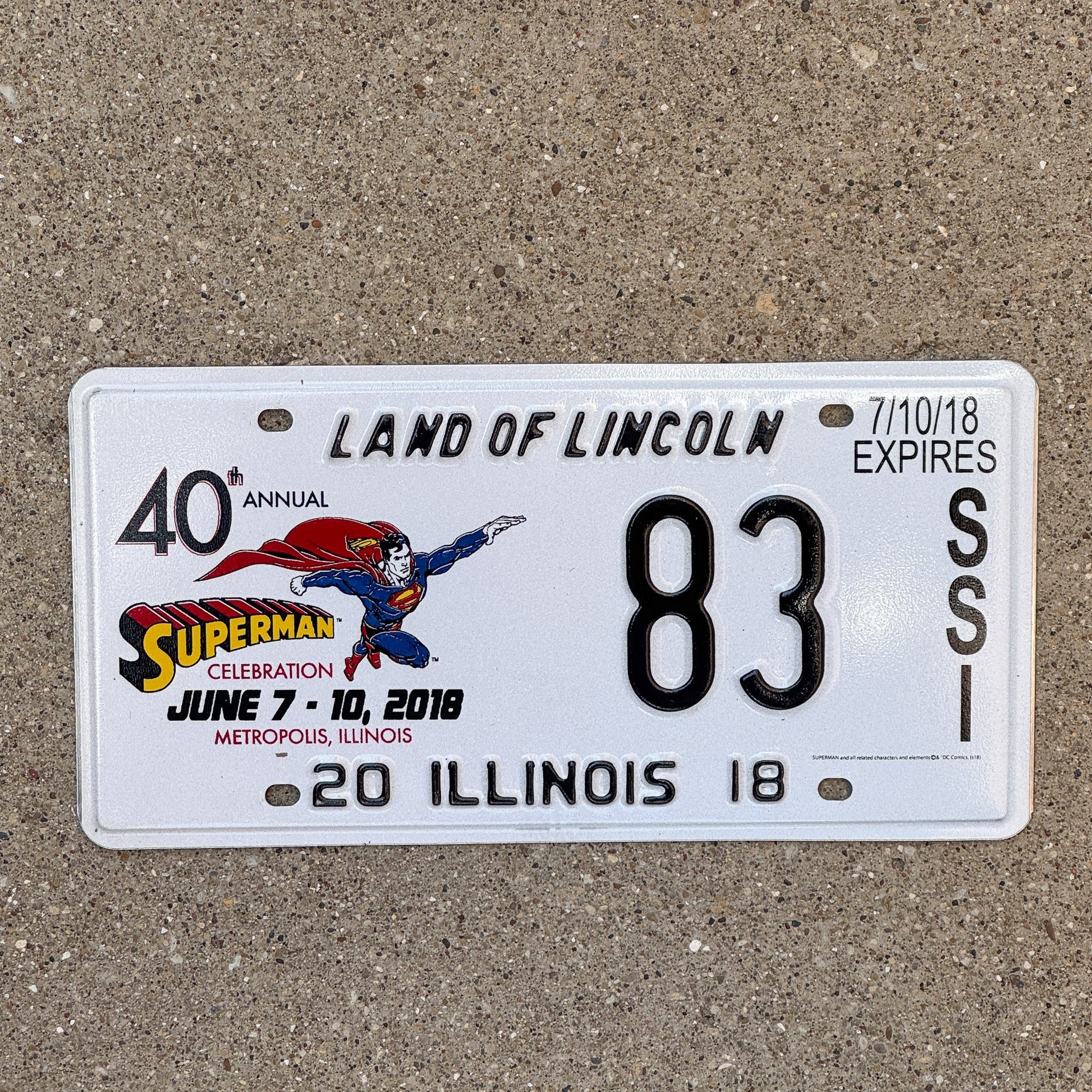Photo of a 2018 Illinois Event License Plate Auto Tag 2 Garage Decor Metropolis Illinois Superman Comics 83 with original patina