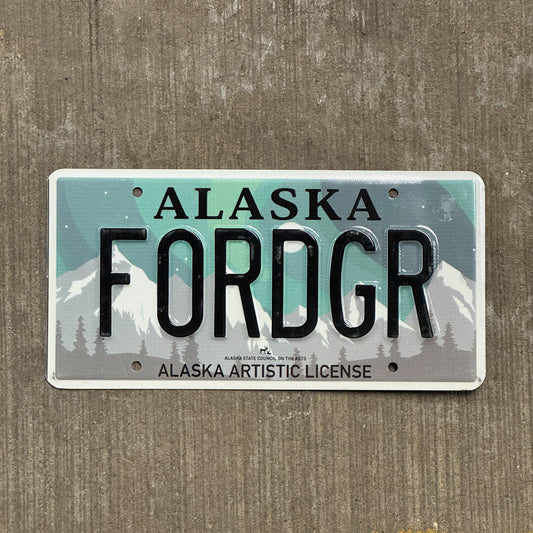 Photo of a 2019 Alaska Graphic Vanity License Plate Auto Tag 1 Vintage Garage Artistic Northern Lights Ford GR Forger FORDGR with original patina