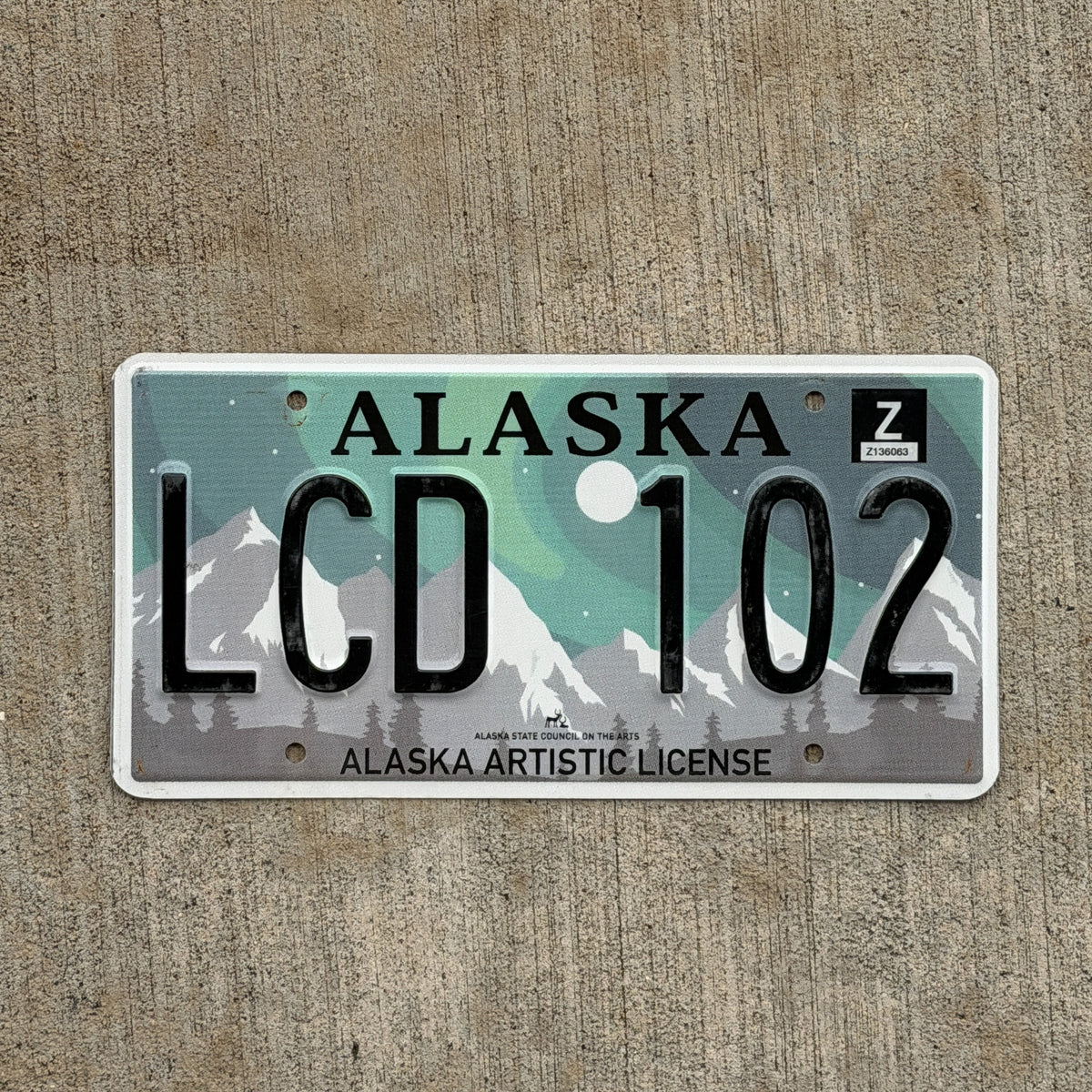 Photo of a 2019 Alaska License Plate Auto Tag Garage Decor Vintage Artistic Northern Lights LCD 102 with original patina