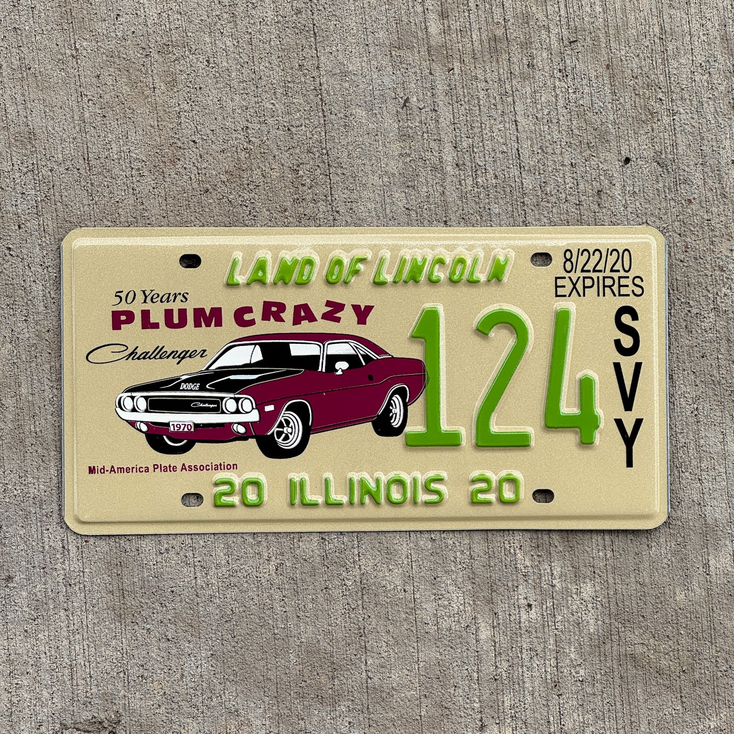 Photo of a 2020 Illinois Event License Plate Auto Tag Garage Decor Vintage Dodge Challenger Plum Crazy MAPA 124 with original patina
