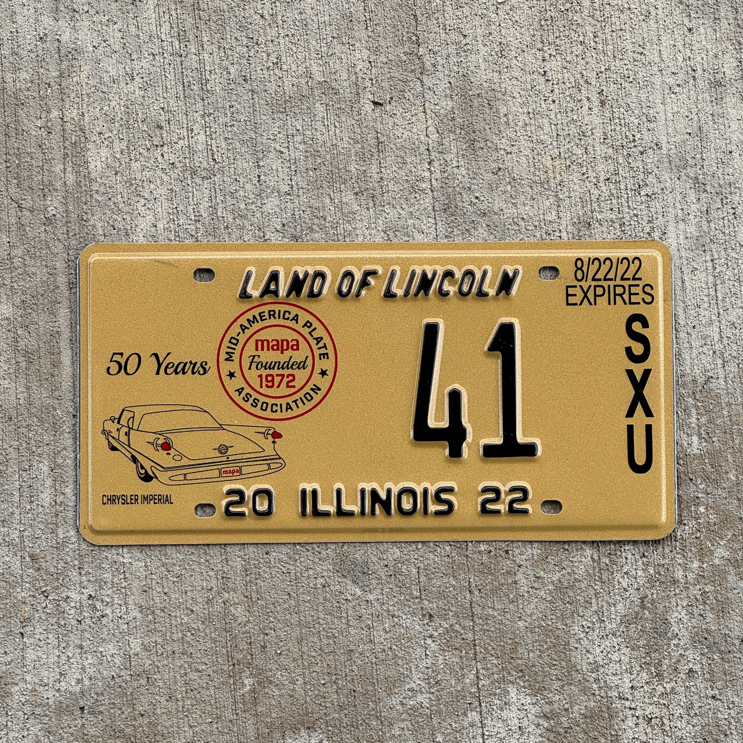 Photo of a 2022 Illinois Event License Plate Auto Tag Garage Decor Vintage Chrysler Imperial MAPA 41 with original patina