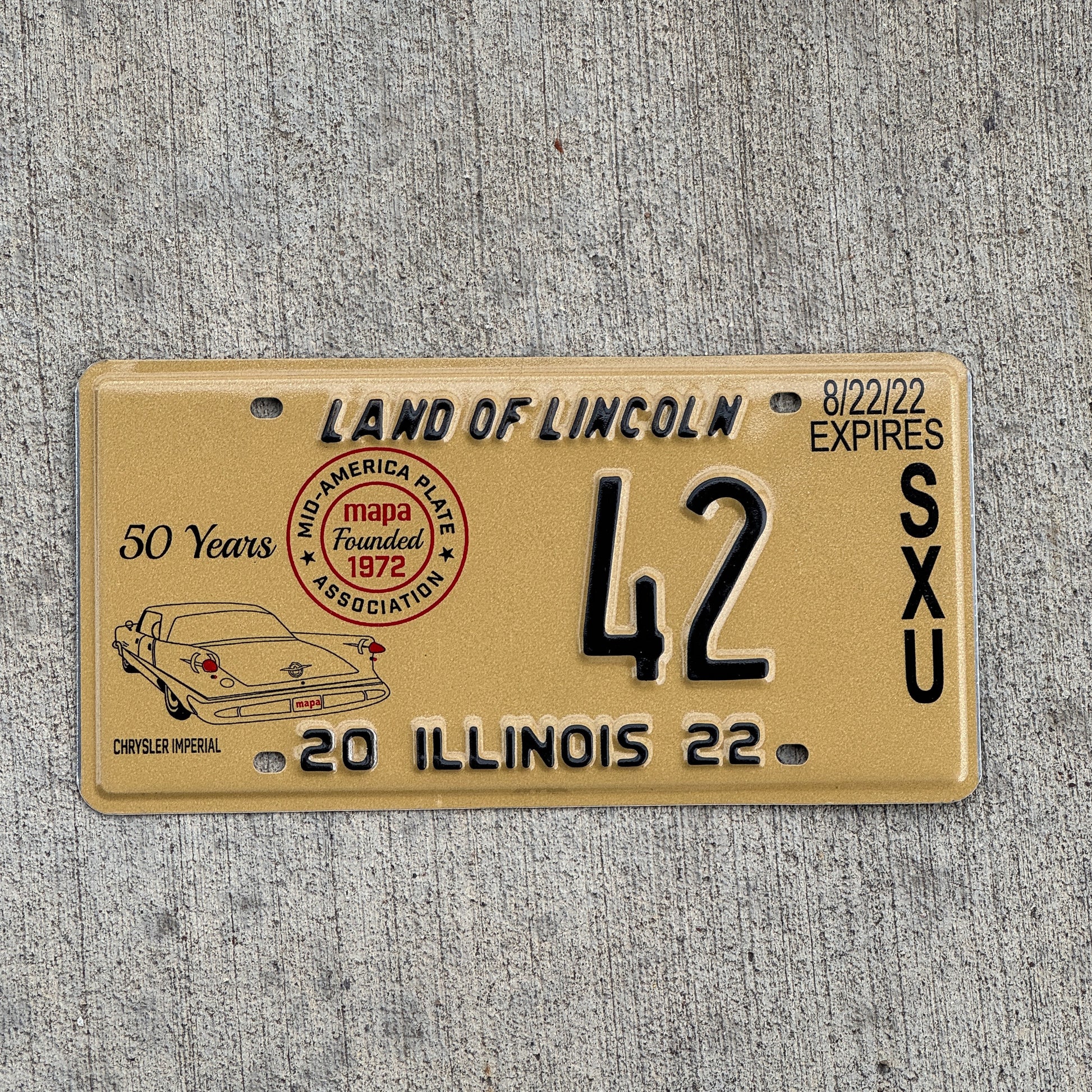 Photo of a 2022 Illinois Event License Plate Auto Tag Garage Decor Vintage Chrysler Imperial MAPA 42 with original patina