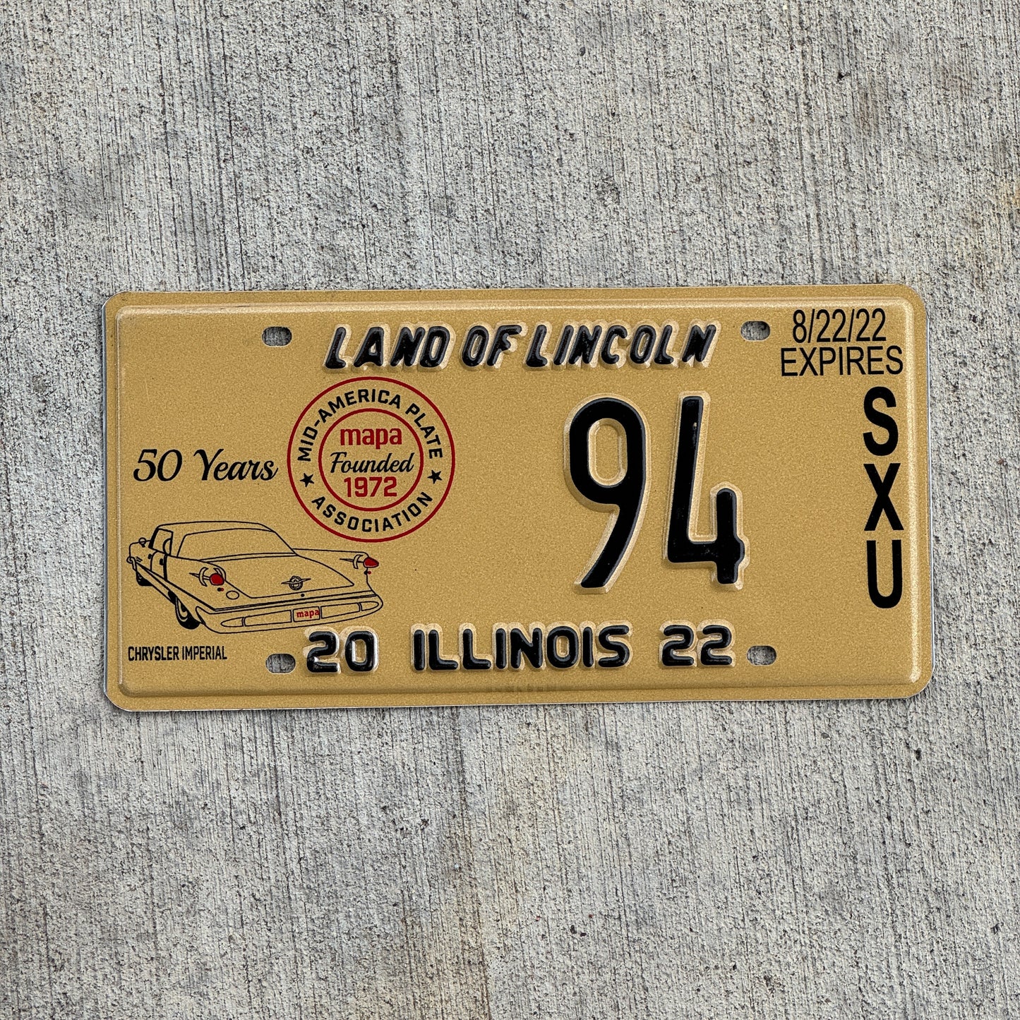 Photo of a 2022 Illinois Event License Plate Auto Tag Garage Decor Vintage Chrysler Imperial MAPA 94 with original patina