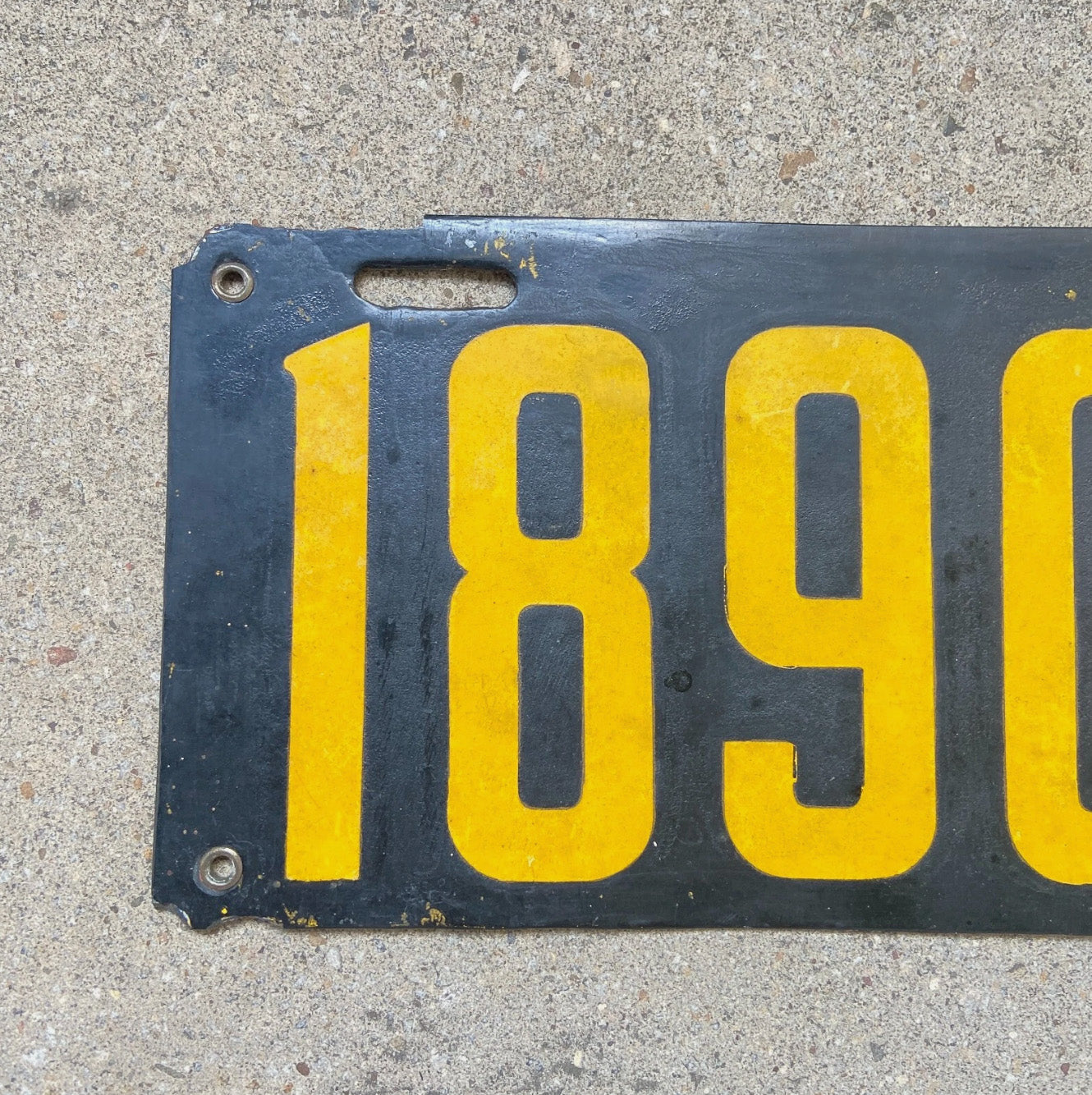 A detail view of the 1914 Delaware porcelain license plate.