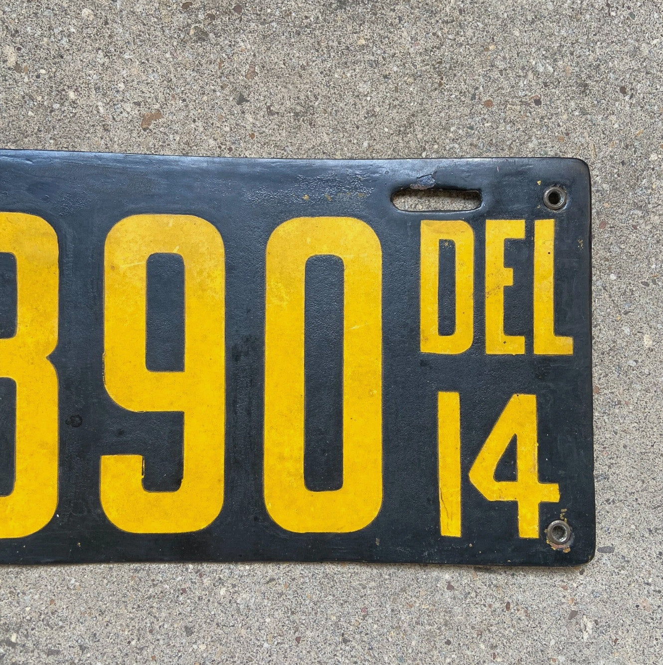 A detail view of the 1914 Delaware porcelain license plate.