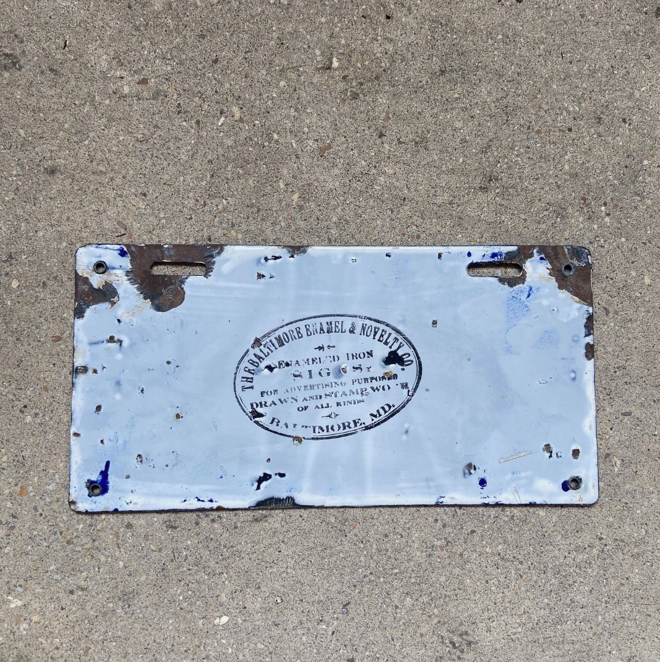 A detail view (back side) of the 1915 Delaware porcelain license plate.