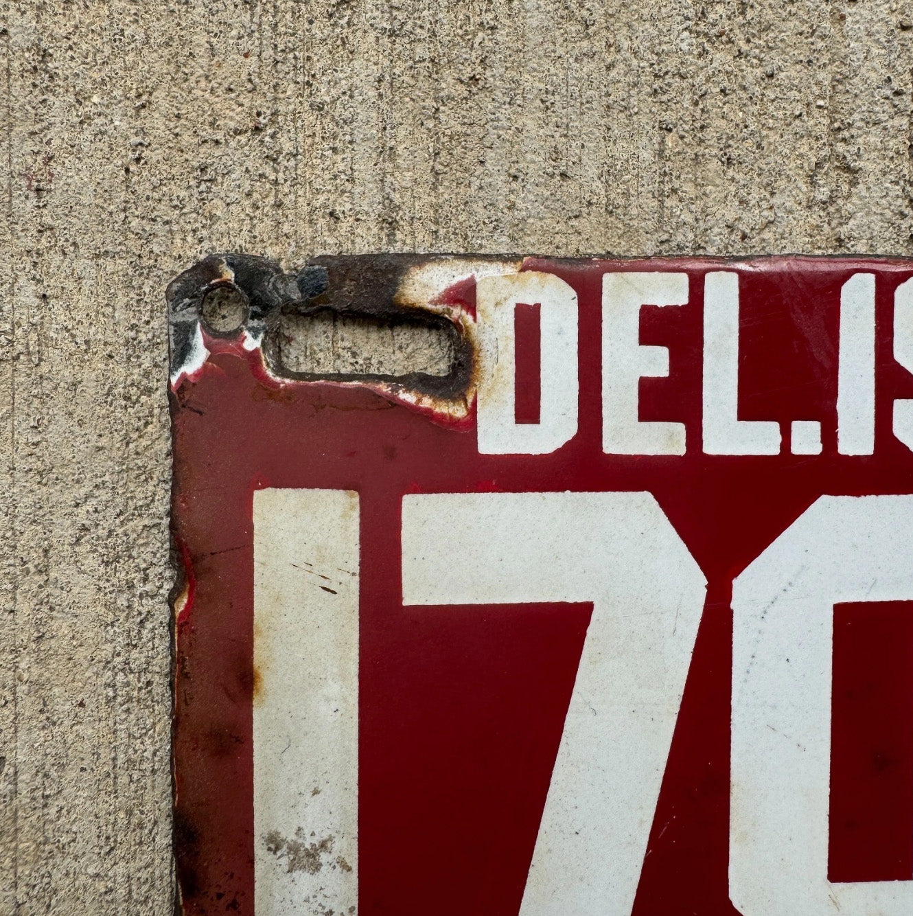 A detail view of the 1912 Delaware porcelain license plate.