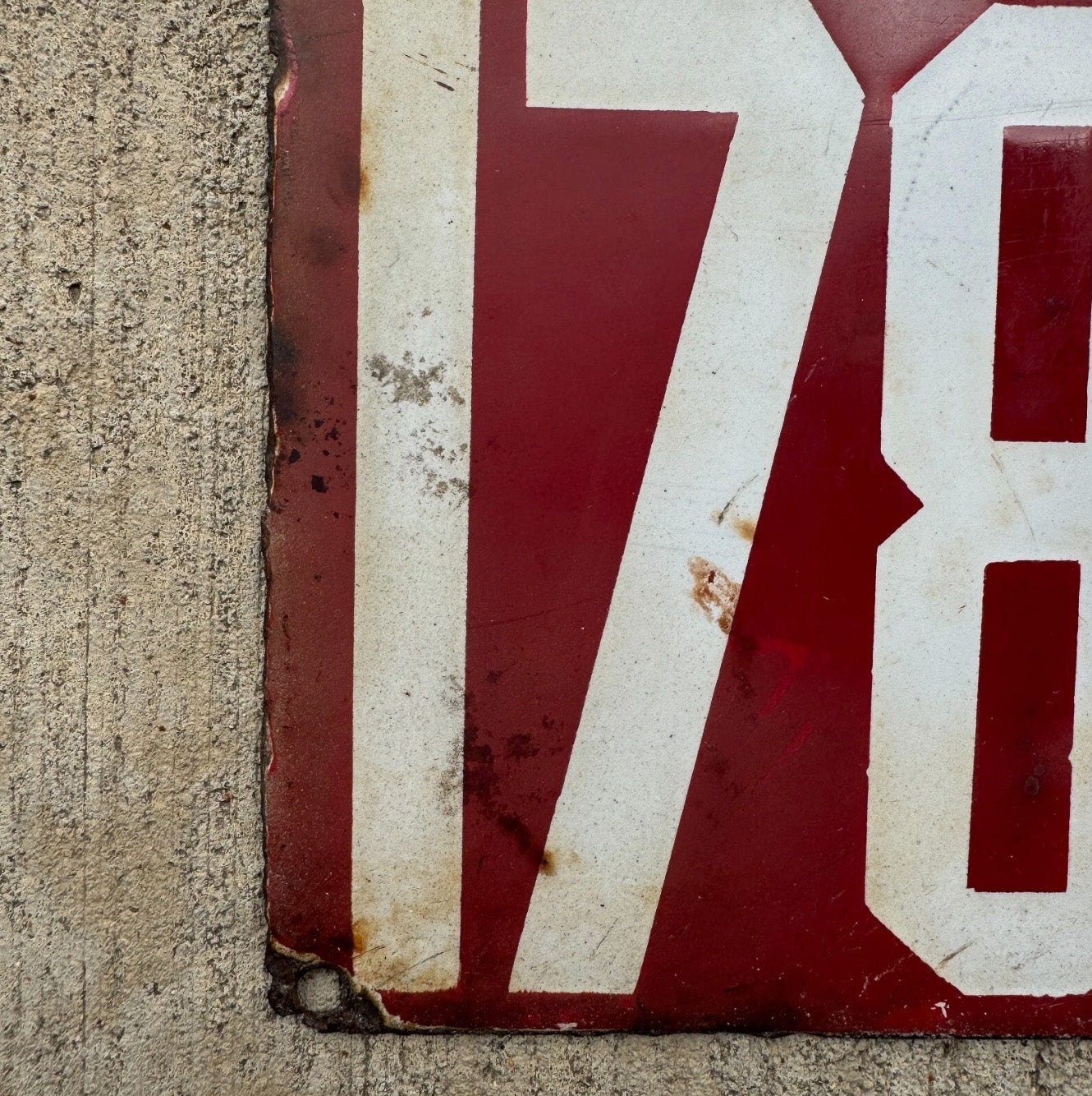 A detail view of the 1912 Delaware porcelain license plate.