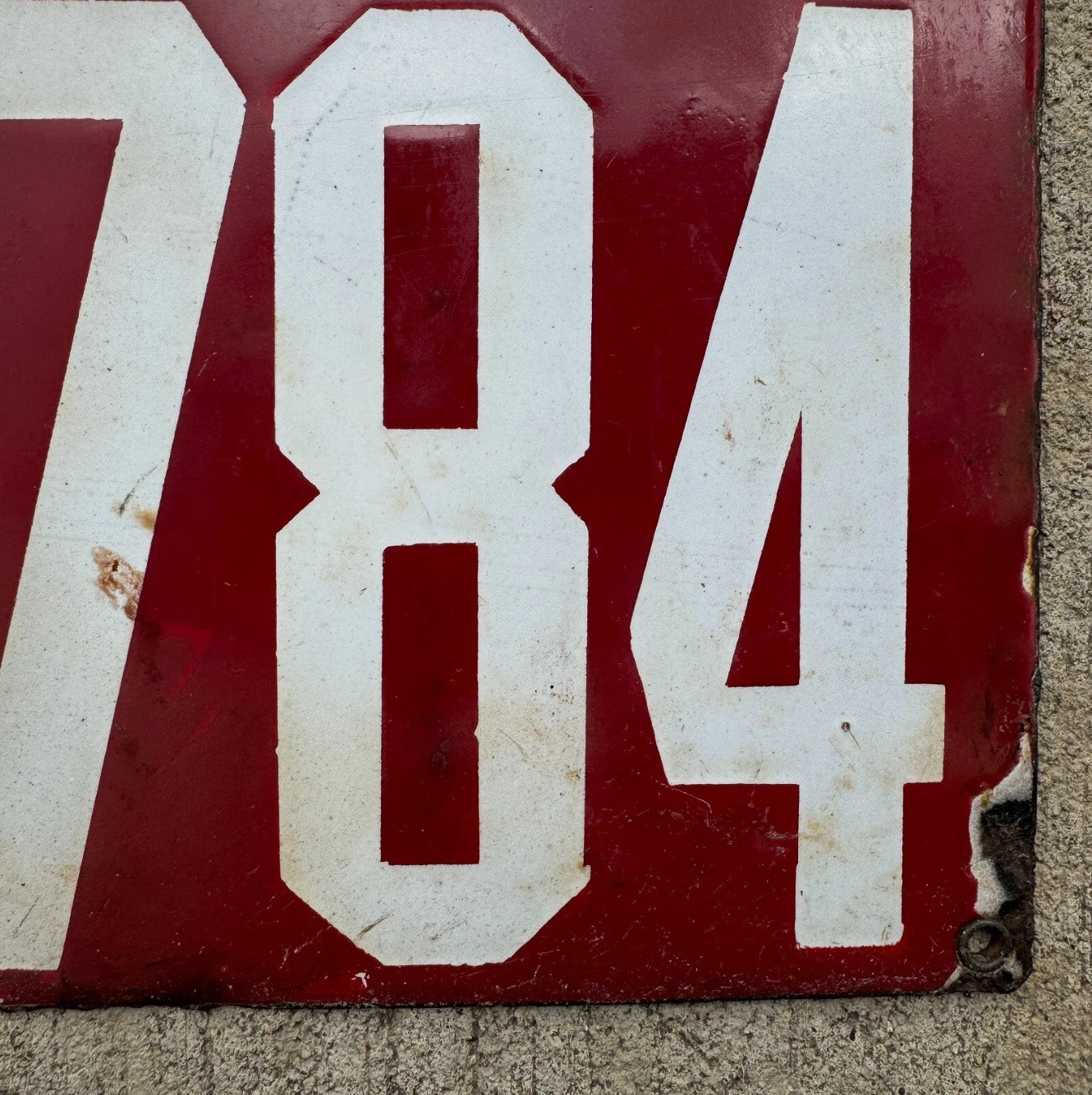 A detail view of the 1912 Delaware porcelain license plate.