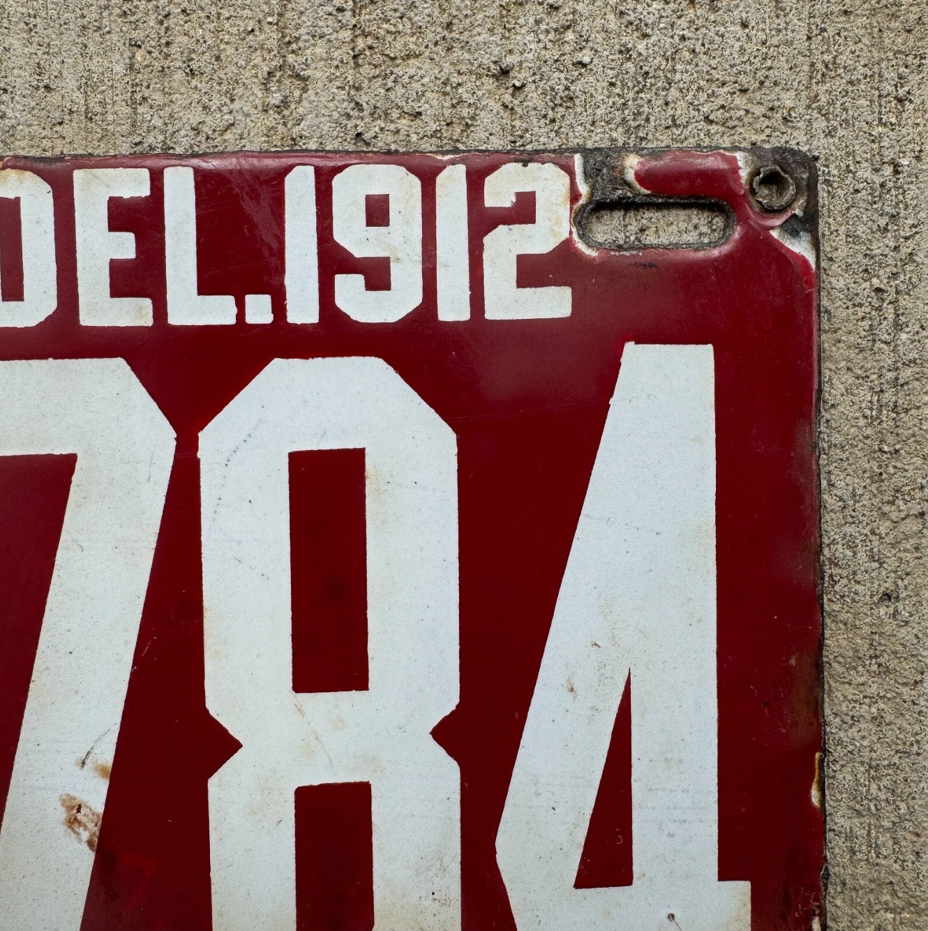A detail view of the 1912 Delaware porcelain license plate.