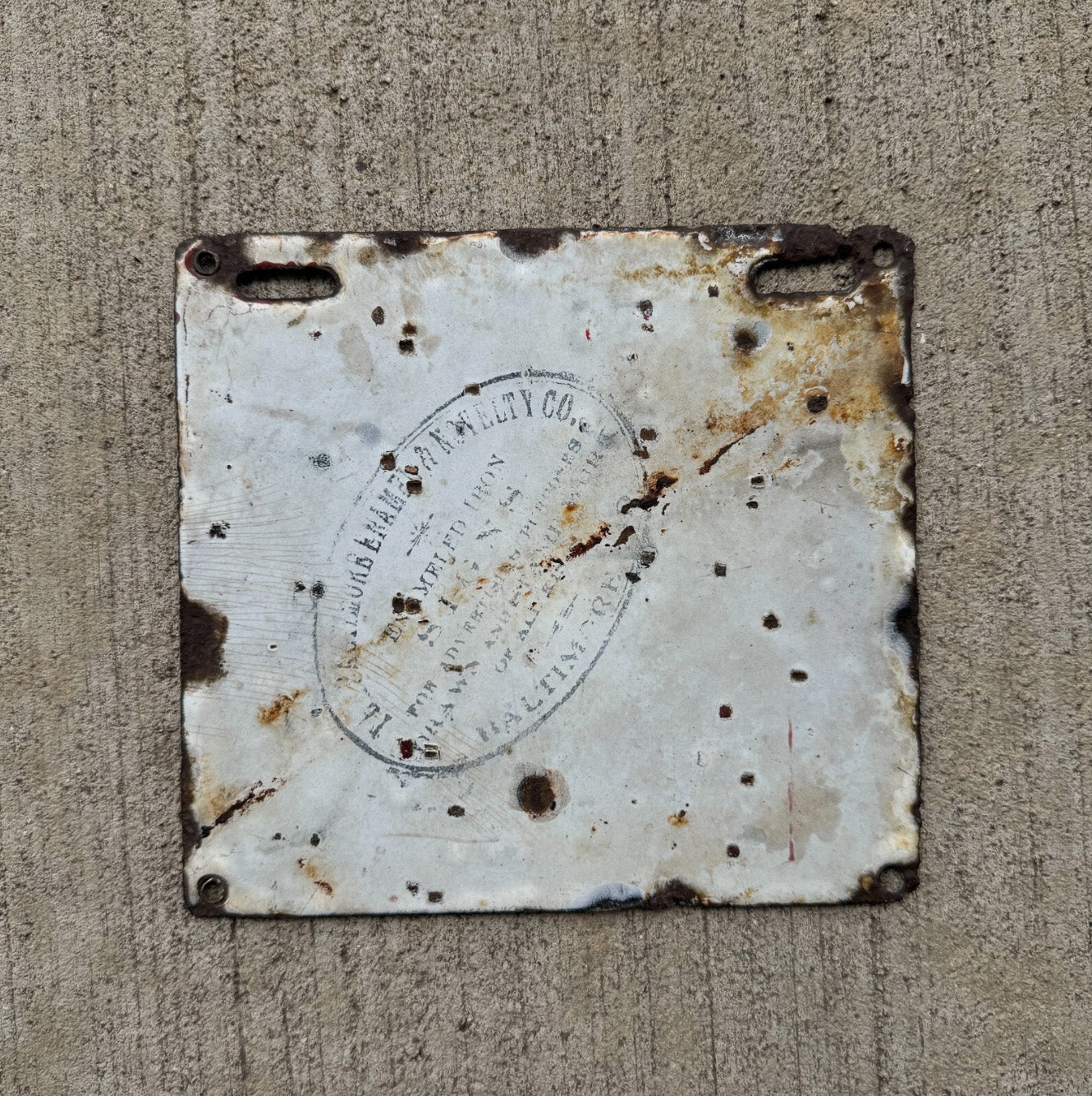 A detail view (back side) of the 1912 Delaware porcelain license plate.