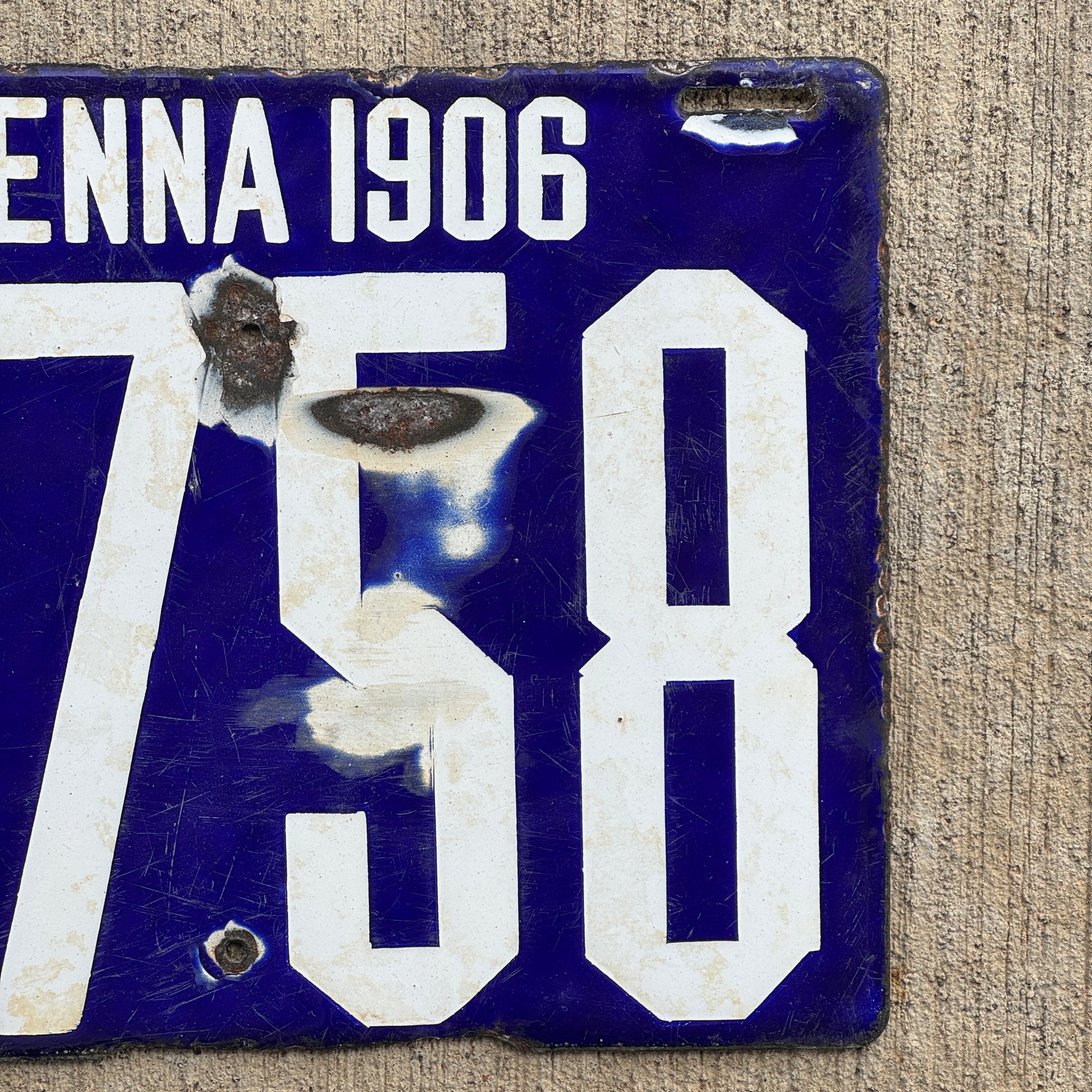 Up close photo of a 1906 Pennsylvania Porcelain License Plate Number 2758