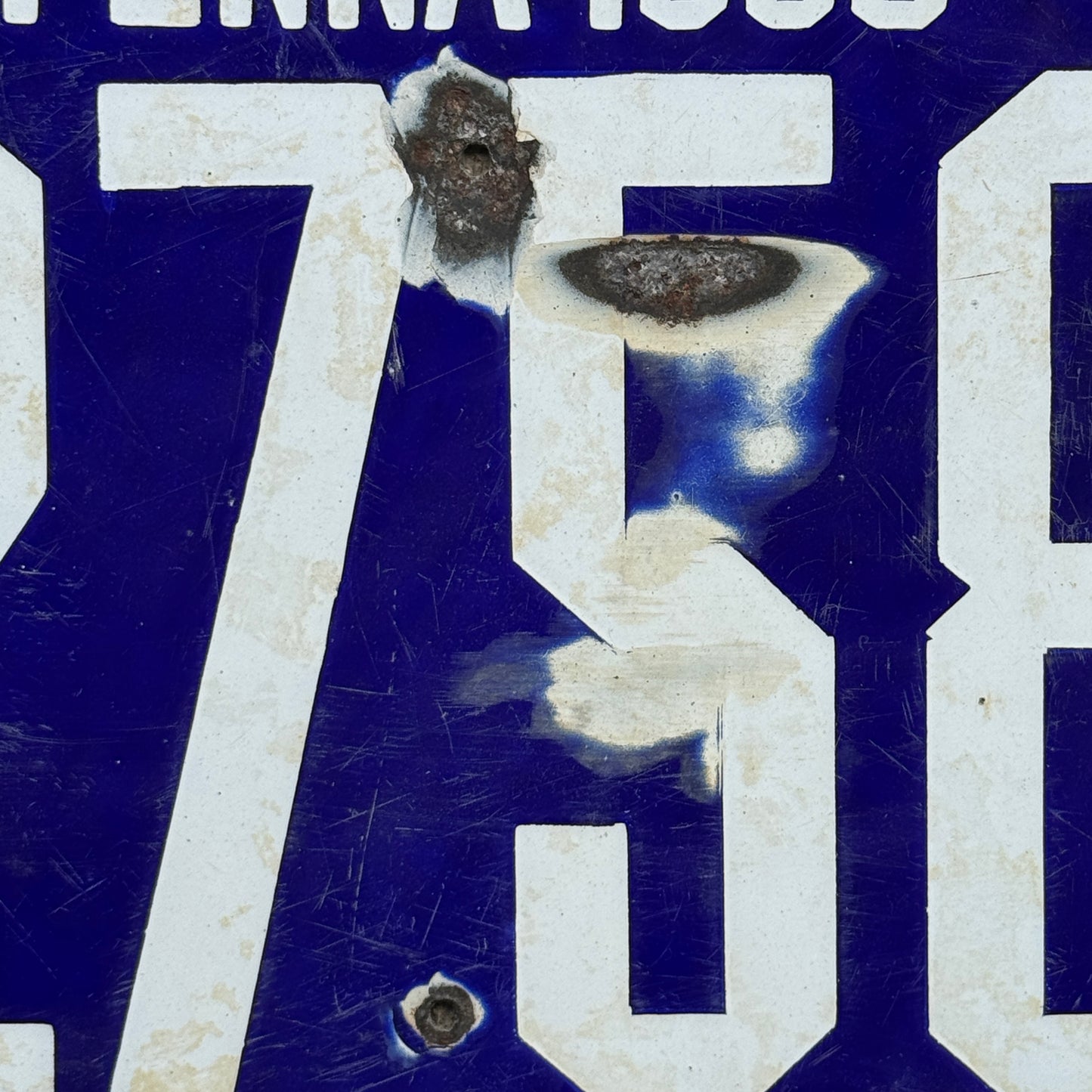 Up close photo of a 1906 Pennsylvania Porcelain License Plate Number 2758