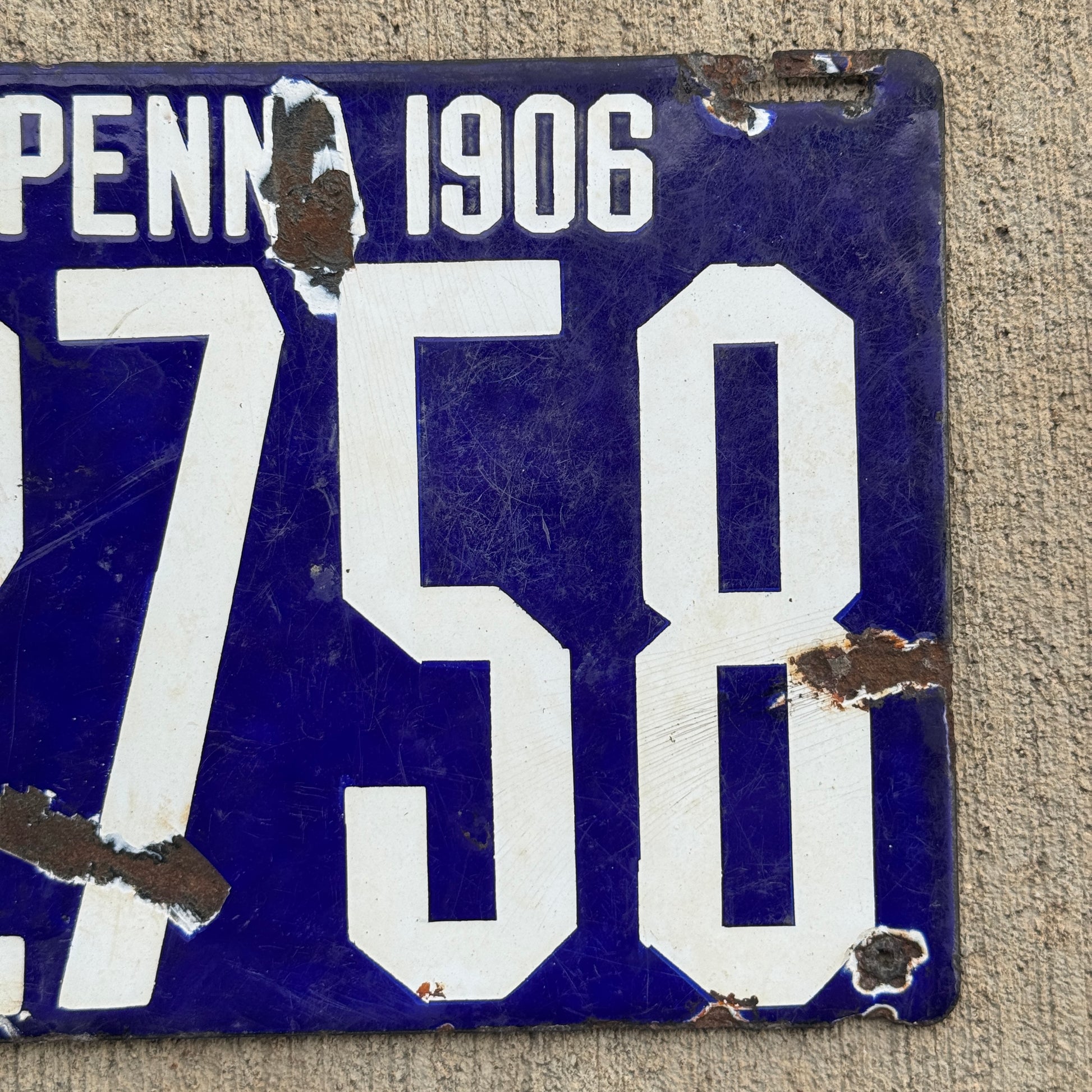 Up close photo of a 1906 Pennsylvania Porcelain License Plate Number 2758