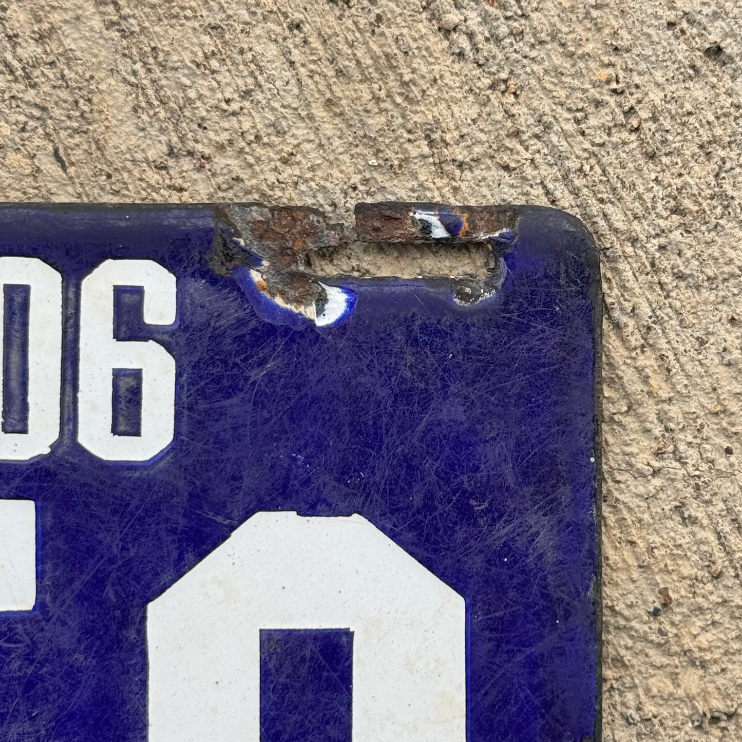 Up close photo of a 1906 Pennsylvania Porcelain License Plate Number 2758