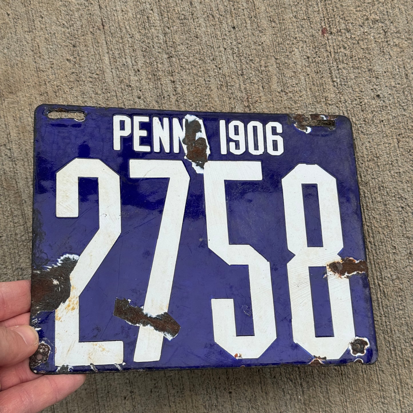 Up close photo of a 1906 Pennsylvania Porcelain License Plate Number 2758