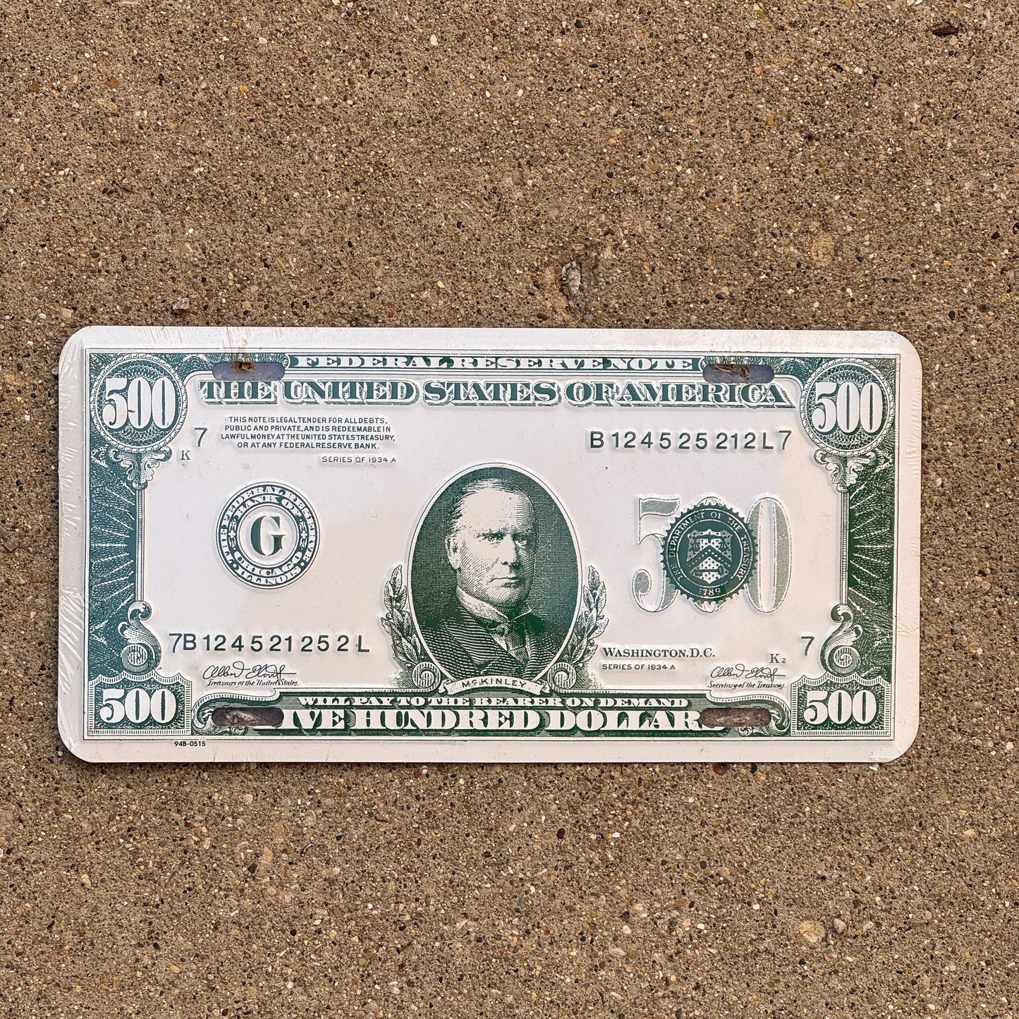 Photo of a Booster License Plate Auto Tag Garage Decor Vintage Metal 500 Dollar Money Cash