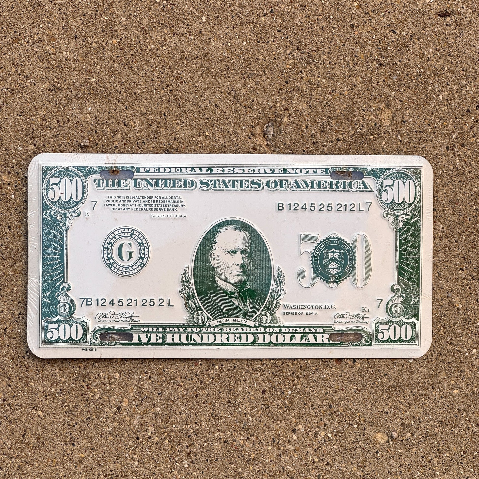 Photo of a Booster License Plate Auto Tag Garage Decor Vintage Metal 500 Dollar Money Cash