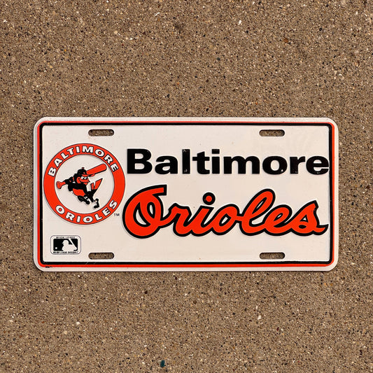 Photo of a Booster License Plate Auto Tag Garage Decor Vintage Metal Baltimore Orioles MLB Baseball Sports