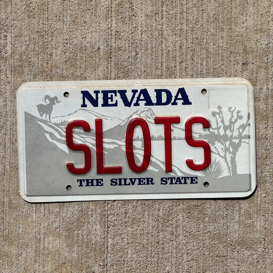 Photo of a Nevada SOUVENIR License Plate Auto Tag Garage Decor Vintage SLOTS