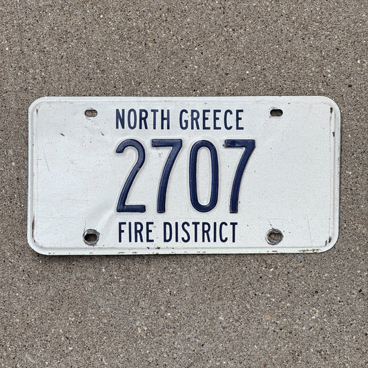 Photo of a New York North Greece Fire District License Plate Auto Tag Garage Decor Vintage Firefighter Fire Dept White 2707