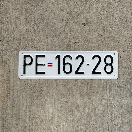 Photo of a Serbia License Plate Auto Tag 2 Vintage PE 162 28 with original patina