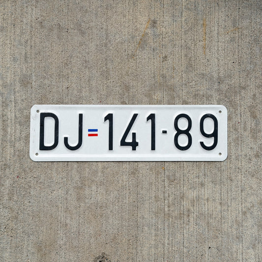 Photo of a Serbia License Plate Auto Tag Garage Decor Vintage DJ 141 89 with original patina