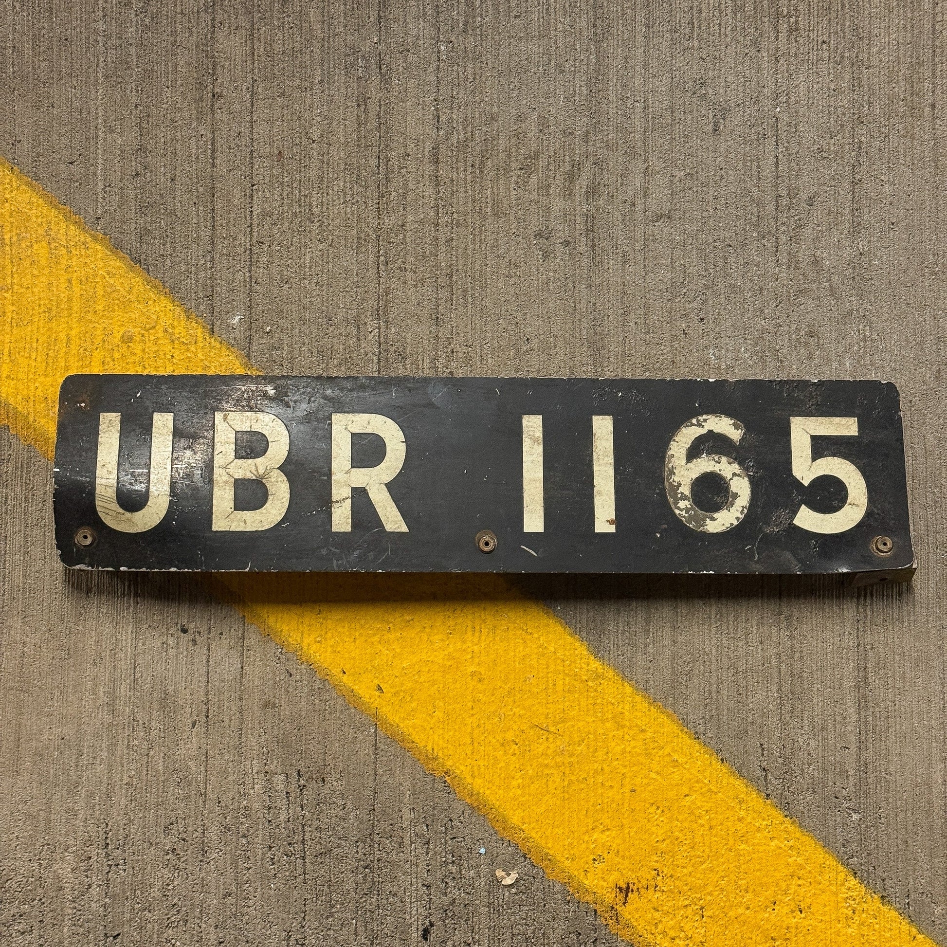 Photo of a Uganda License Plate Auto Tag Garage Decor Vintage UBR 1165 with original patina