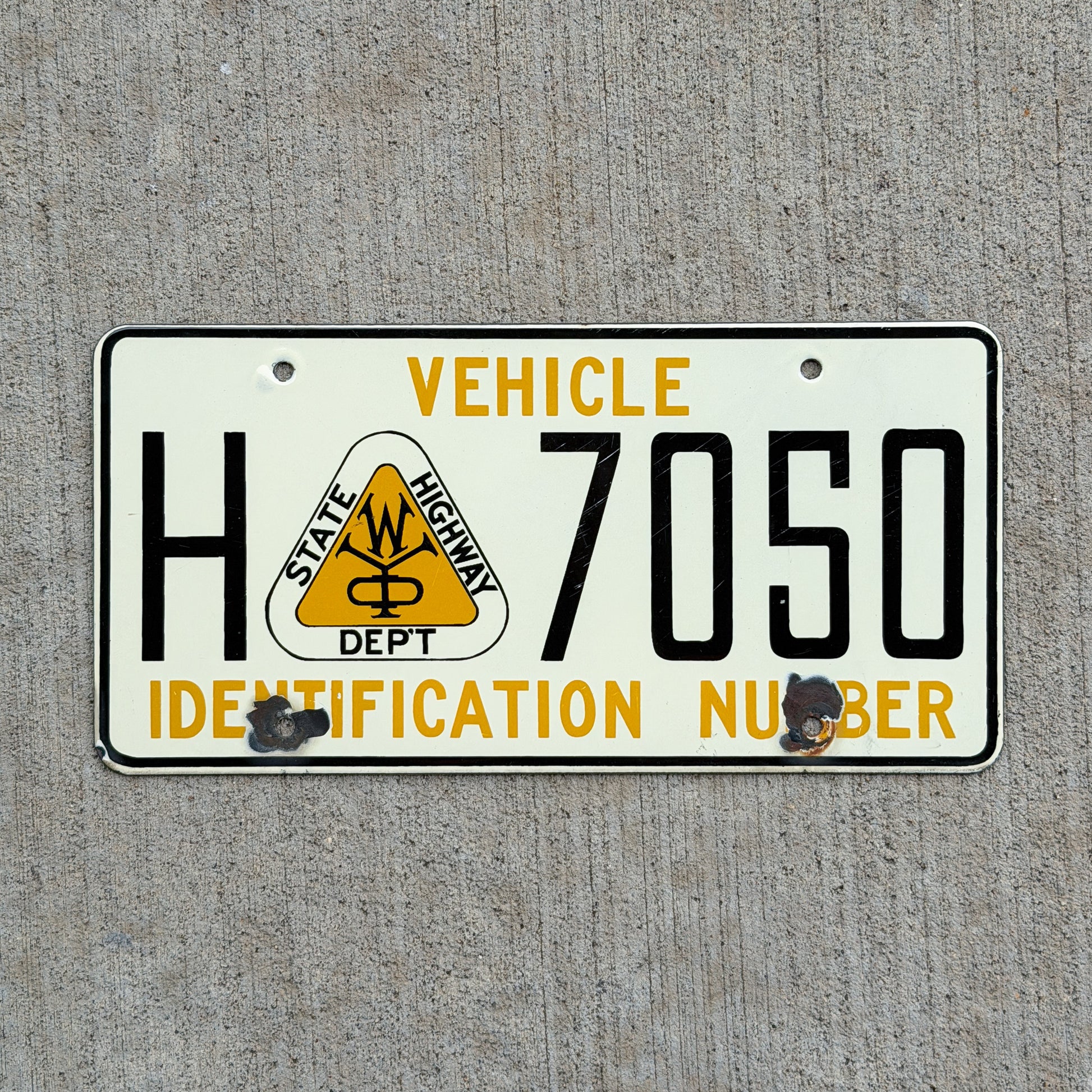 Photo of a Wyoming Porcelain State Highway Department Booster License Plate Auto Tag Garage Decor Vintage H 7050 with original patina
